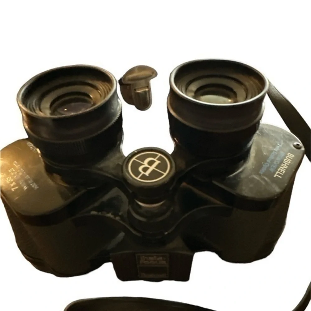 This listing is for a pair of Bushnell Insta Focus 7x35 binoculars with case.